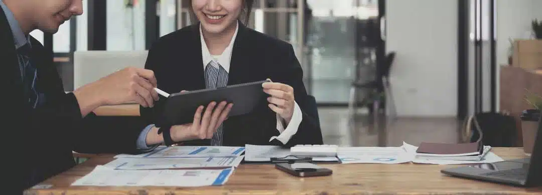 office workers sat around a desk